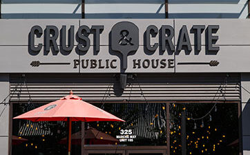 front door of Crust & Crate restaurant at TD Place