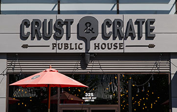 front door of Crust & Crate restaurant at TD Place