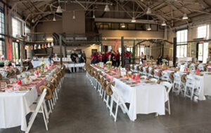 Horticulture Building set up for a wedding with tables and chairs