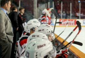 Image of Ottawa 67's players sitting on the bench during a game