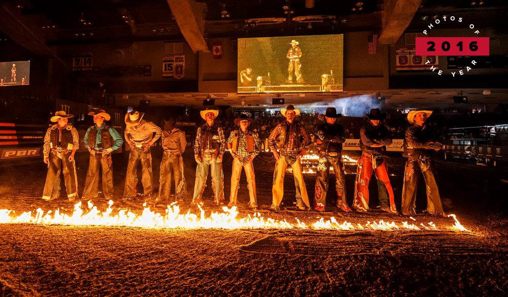 Image of cowboys standing in a line during rodeo at TD Place in 2016