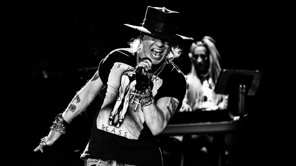 Image of Axl Rose on stage singing
