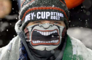 CFL fan dressed up for the 105th Grey Cup outside at TD Place