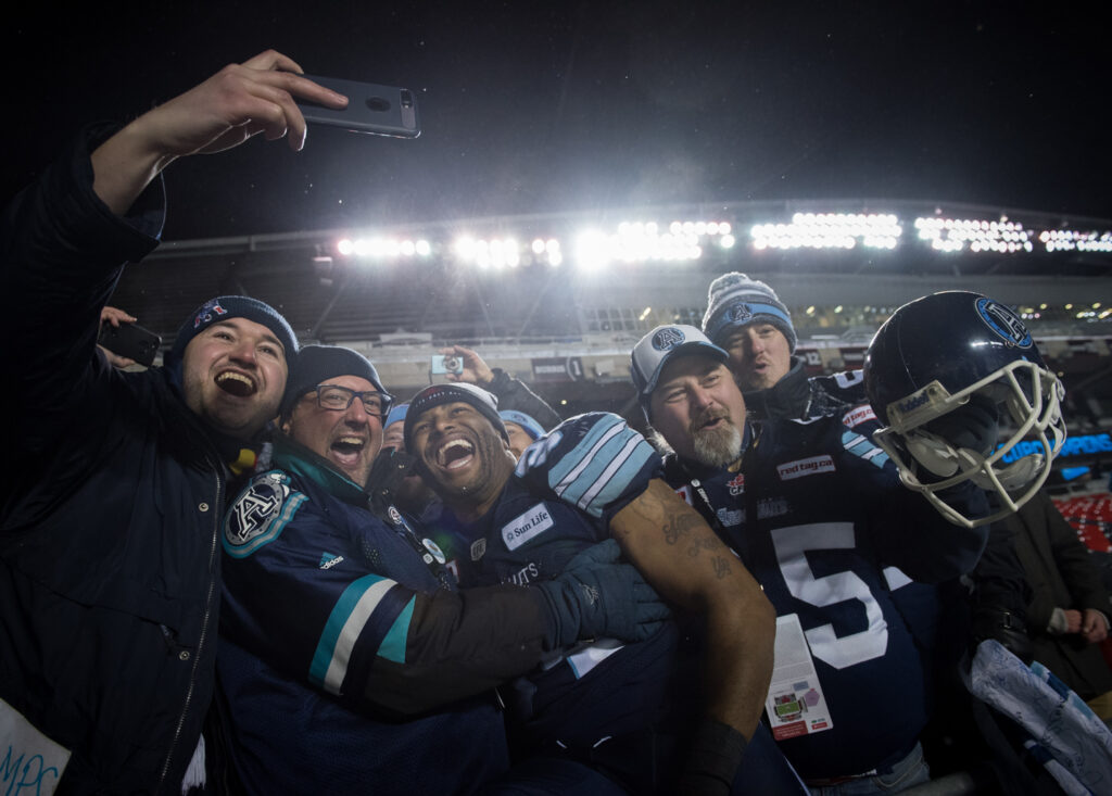 Image of Argos fans celebrating at Grey Cup Festival in Ottawa in 2017