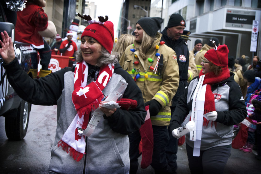 Image of fans at the 105 Grey Cup parade celebrating