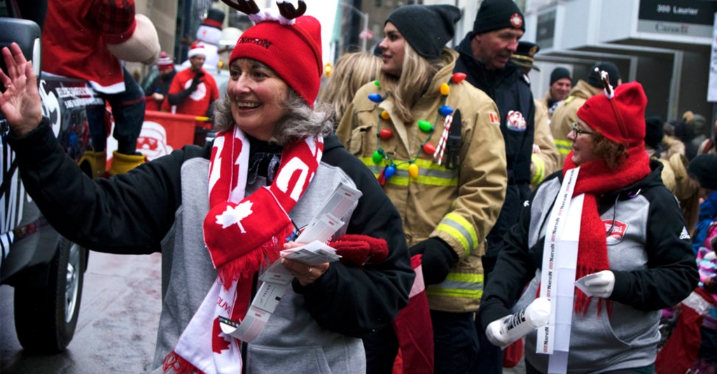 Image of fans at the 105 Grey Cup parade celebrating