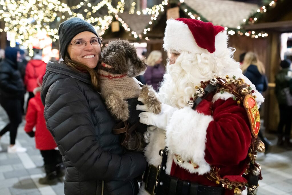 woman with her dog talking with Santa Claus at the Ottawa Christmas Market