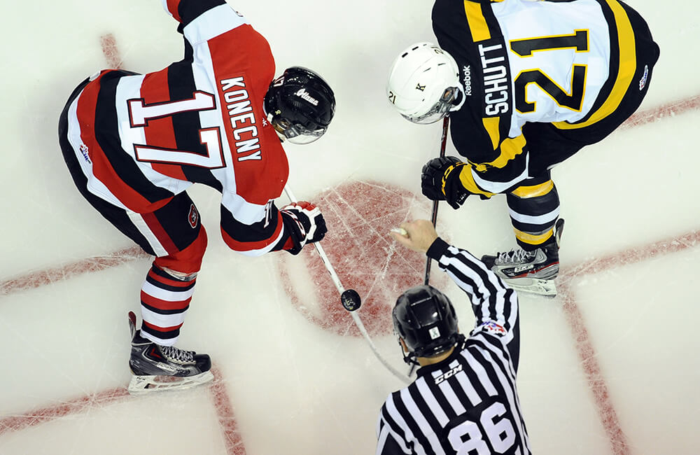 Image of a face off at a 67's game from directly above the face off
