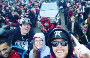 Image of REDBLACKS fans celebrating during the Grey Cup Parada at TD Place