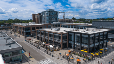 Aerial image of Local and Milestones resturants with their patios open