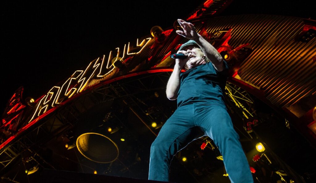 Image of Brian Johnson of AC/DC performing on stage at TD Place
