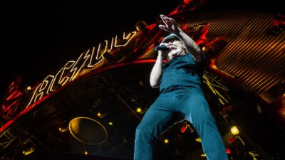 Image of Brian Johnson of AC/DC performing on stage at TD Place