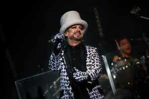 Image of Boy George performing live on stage at TD Place