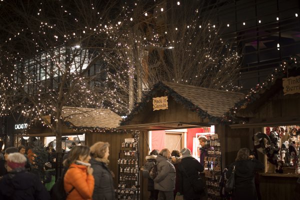 Ottawa Christmas Market vendors and shoppers at night