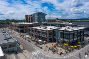Aerial image of Local and Milestones resturants with their patios open