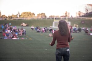 Image of woman standing on the field during Movie Night at TD Place