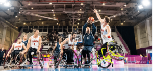 Image of basketball players in wheelchairs playing on the court