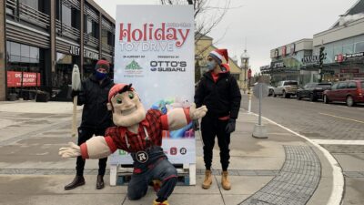 Big Joe and 2 67's players promoting the Holiday Toy Drive.