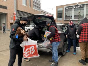 67's players and staff working at the holiday toy drive at TD Place