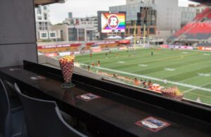 Otto's Club Loge at the Stadium with popcorn and the field on the window