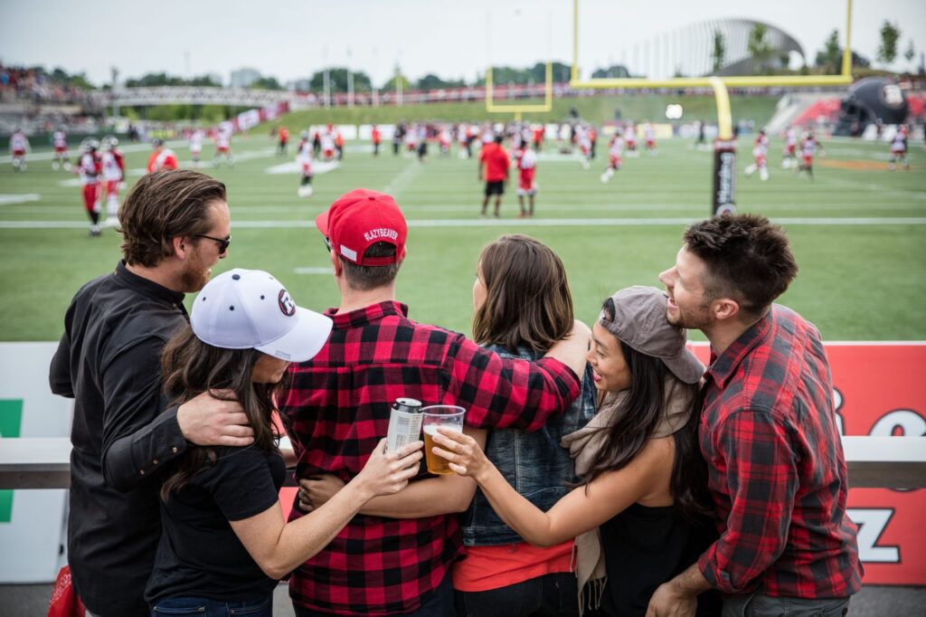 Six Friends Watching the REDBLACKS Game in the Log Cabin at TD Place