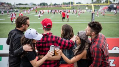 Six Friends Watching the REDBLACKS Game in the Log Cabin at TD Place